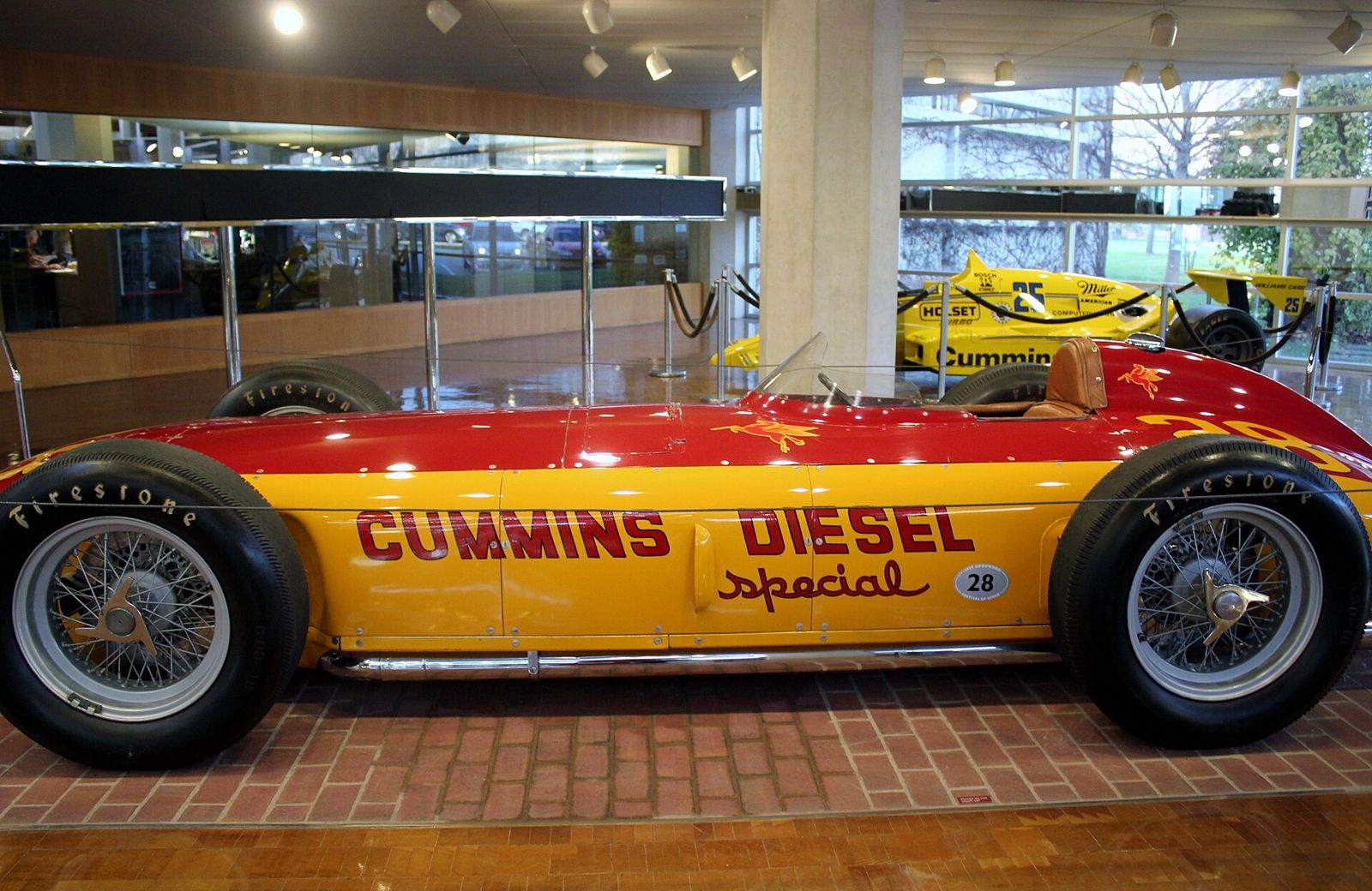 Cummins: Red and yellow vintage race car with Cummins Diesel Special lettering