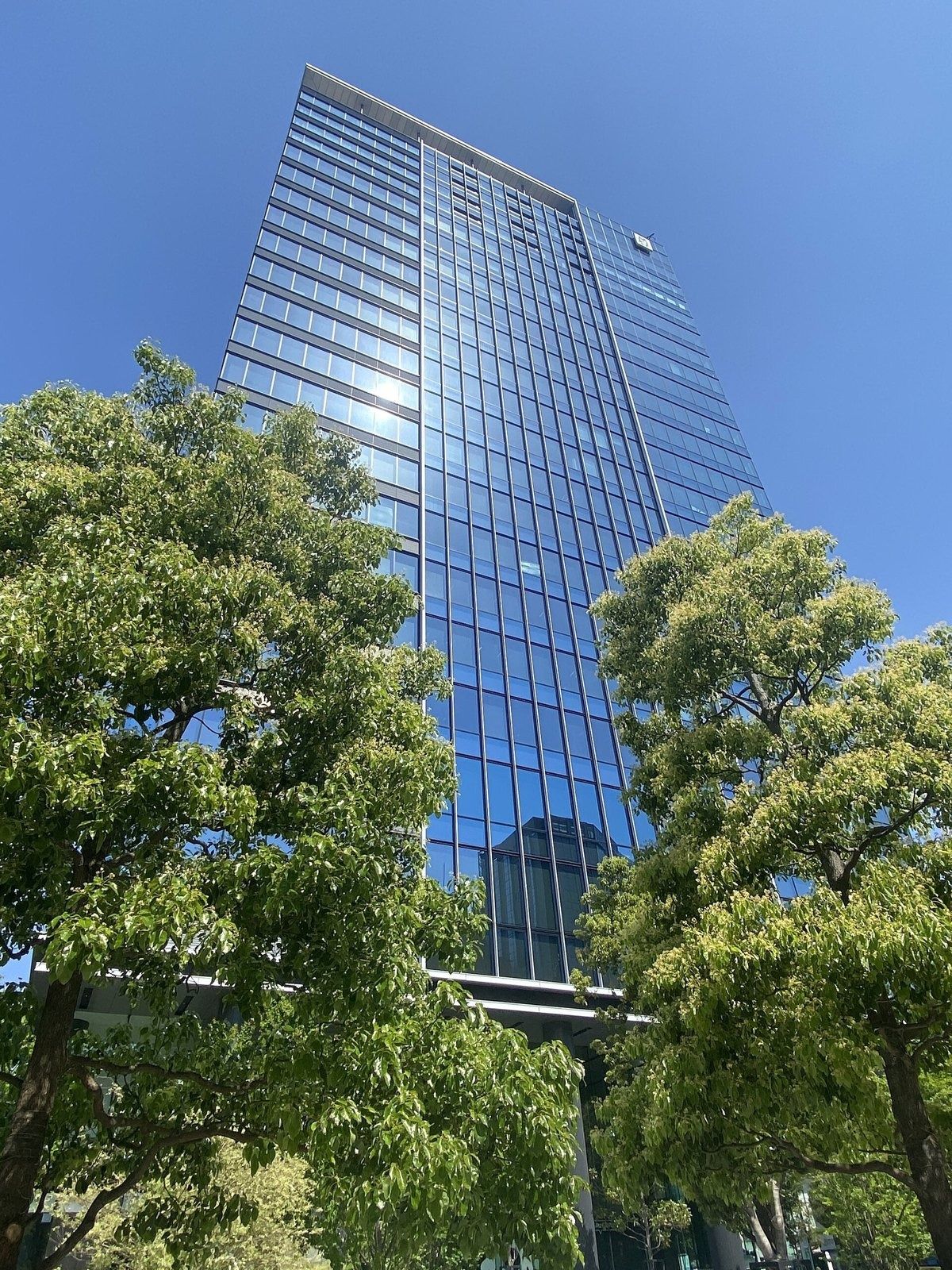 CyberAgent: Glass tower seen through trees