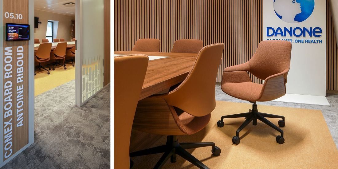 Danone: Glass door labelled Comex Board Room Antoine Riboud next to a wooden table and terracotta chairs