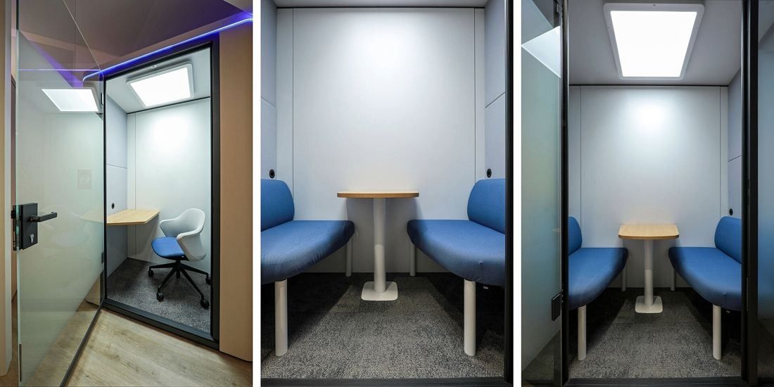Danone: Three views of glass booths with blue upholstered benches and a small round table