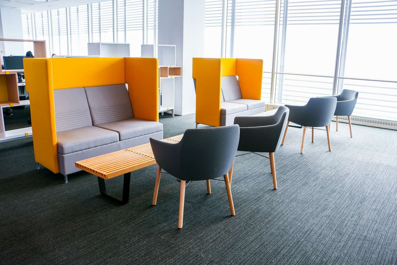 Datadog: Orange high-backed sofas and armchairs by the windows