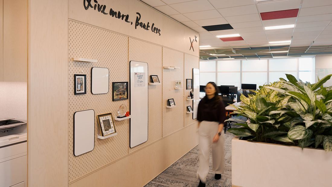 DBS Bank: Pegboard wall with frames and whiteboards under the words Live more, Bank less