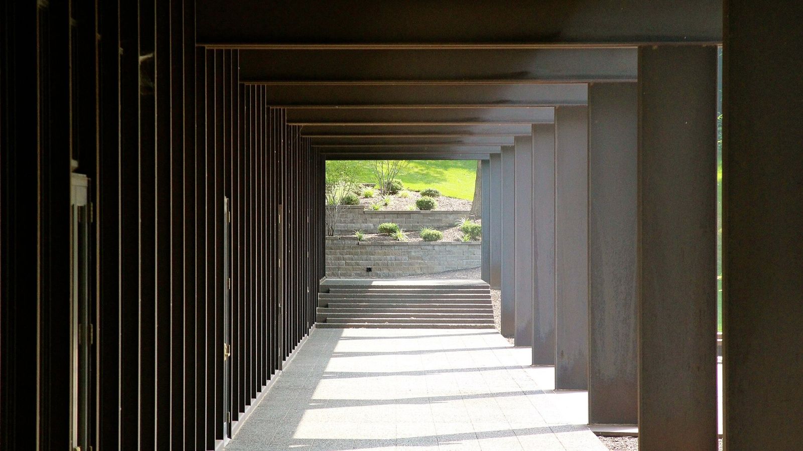John Deere: Covered walkway with rows of rusted steel fins