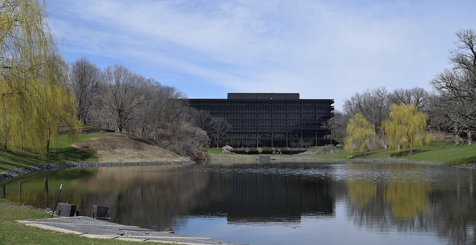John Deere: Lake with willows and the building beyond