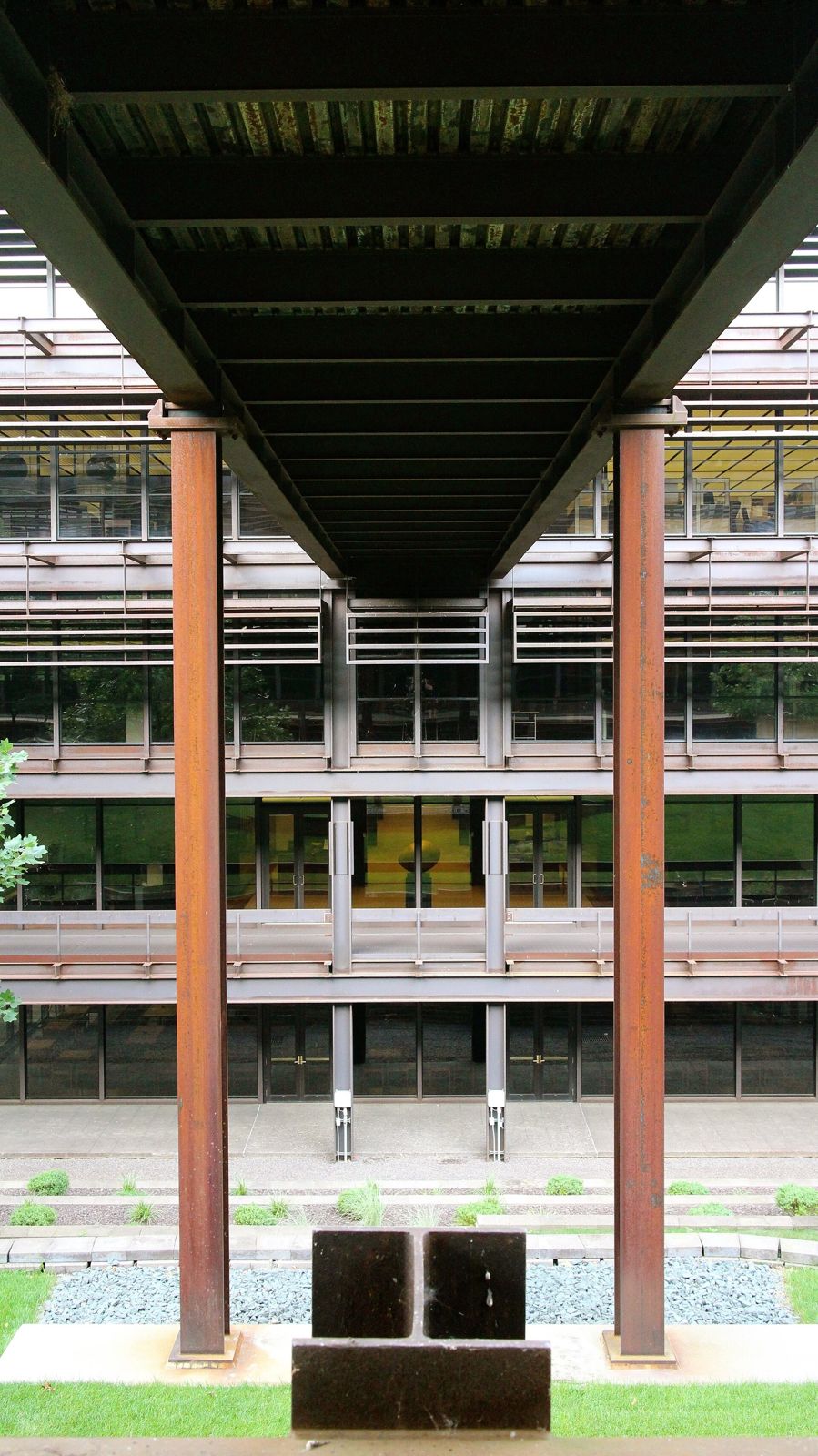 John Deere: Looking through steel columns to a courtyard and sculpture