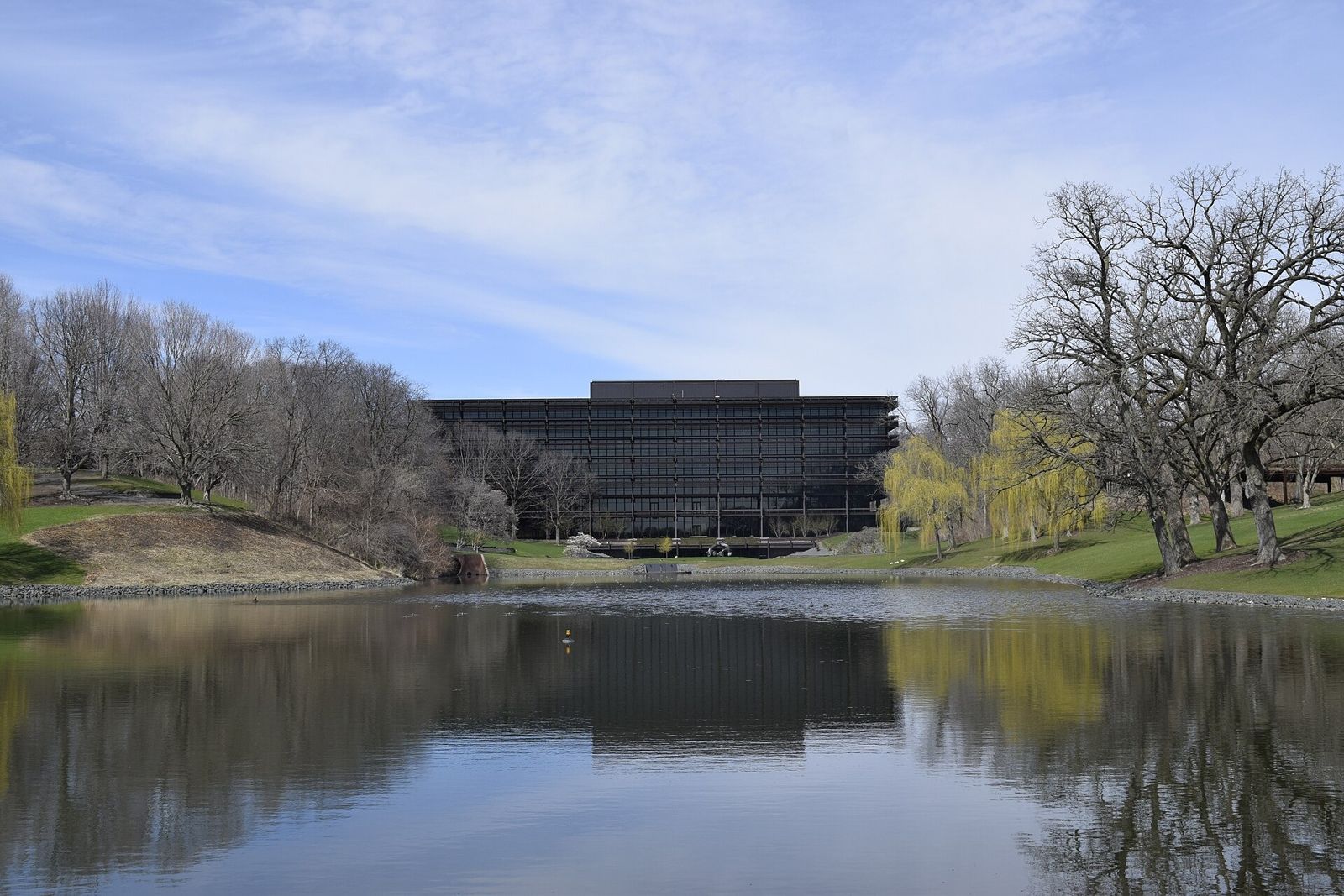 John Deere: Pond reflecting the headquarters and bare trees