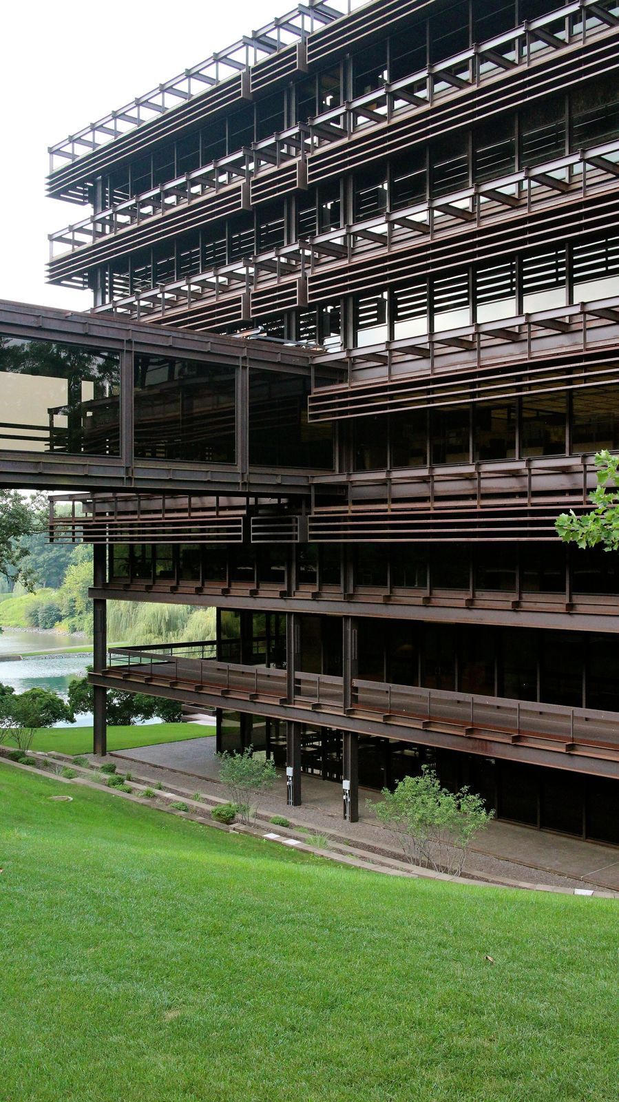 John Deere: Tall steel facade above a lawn