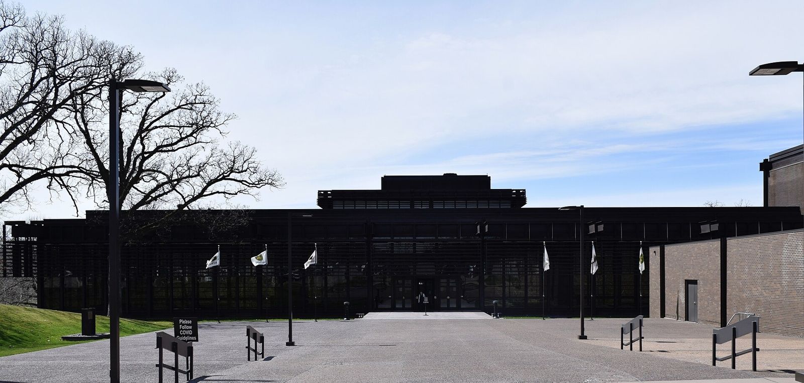 John Deere: Wide plaza with flags in front of a low steel building