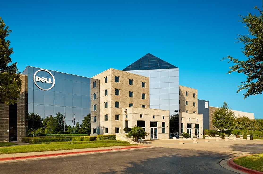 Dell's Round Rock headquarters with a glass pyramid and the Dell logo