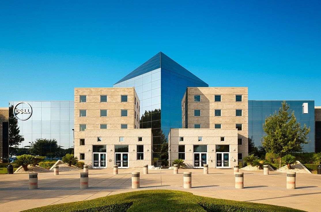 Dell Technologies: Symmetric stone wings around a glass pyramid