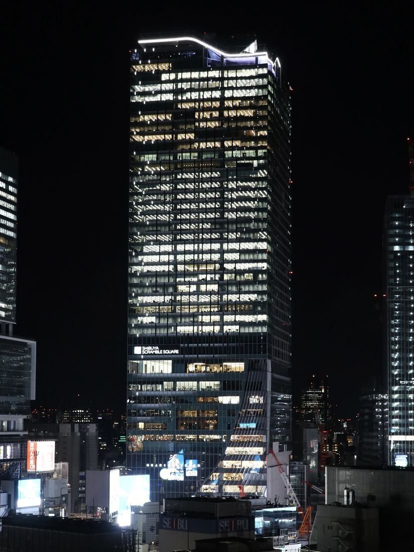 DeNA: Office tower with lit windows at night