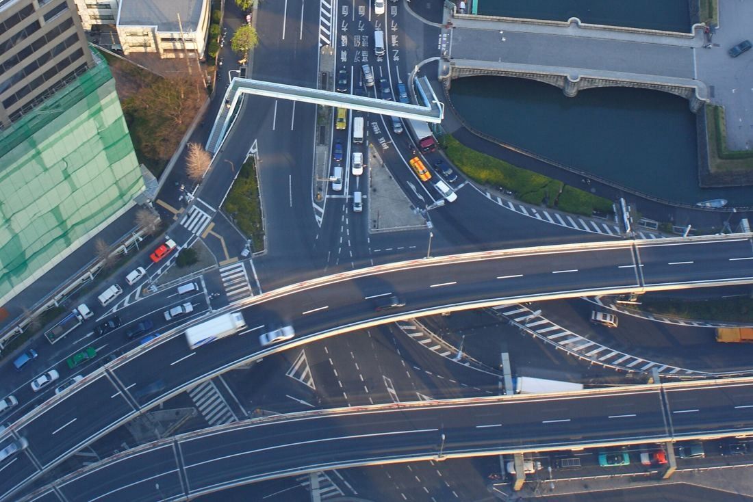 Dentsu: Looking straight down on a busy road intersection and elevated highways