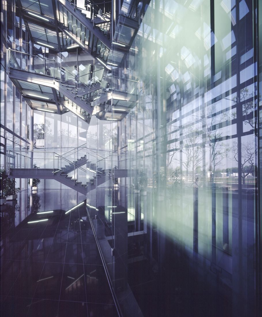 DHL Group: Glass atrium with suspended stairs and daylight streaming in