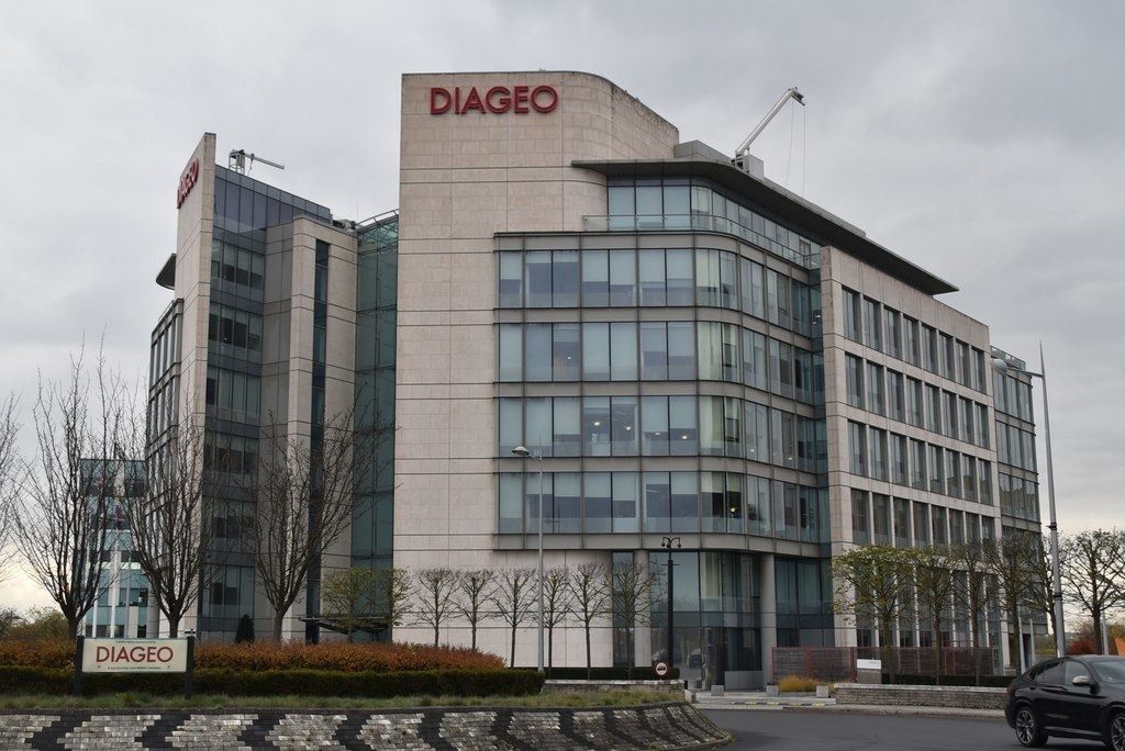 Curved glass and stone office building with the DIAGEO name on top