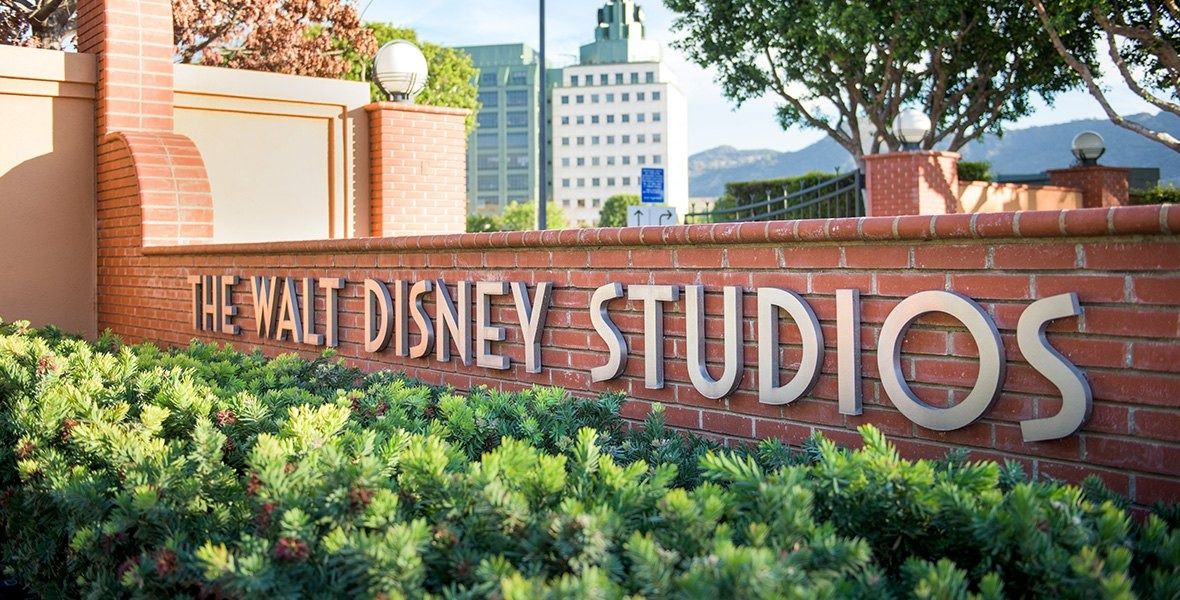 The Walt Disney Company: The Walt Disney Studios sign by a hedge