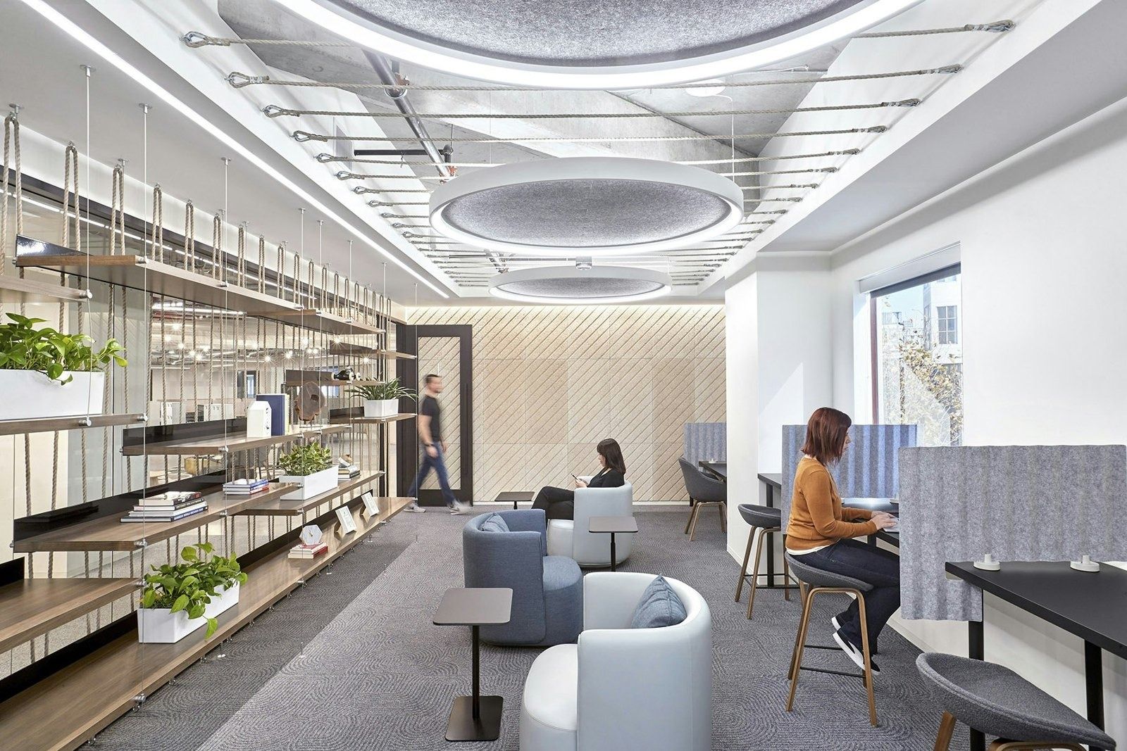 DoorDash: Library-style lounge with shelves and a round ceiling light