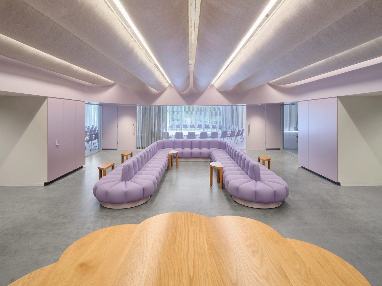 Dropbox: A lilac room with a long upholstered banquette