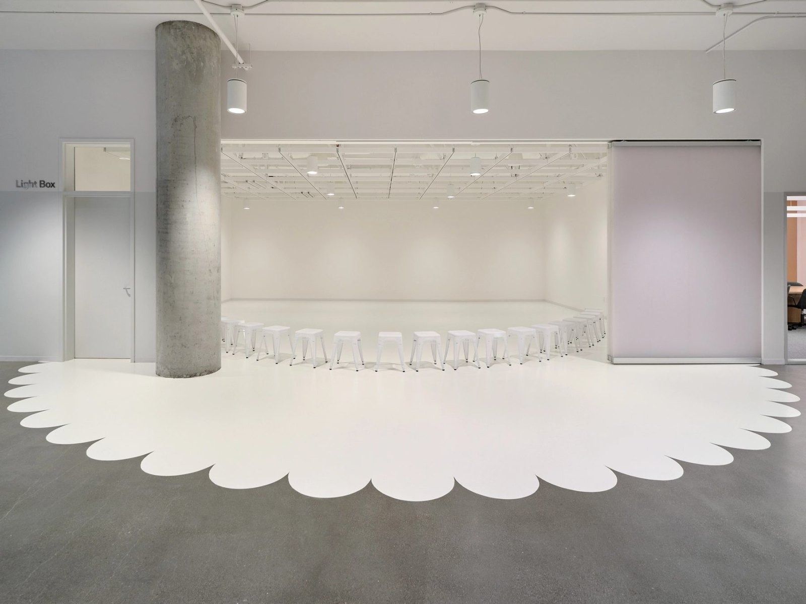 Dropbox: A room with a scalloped white floor