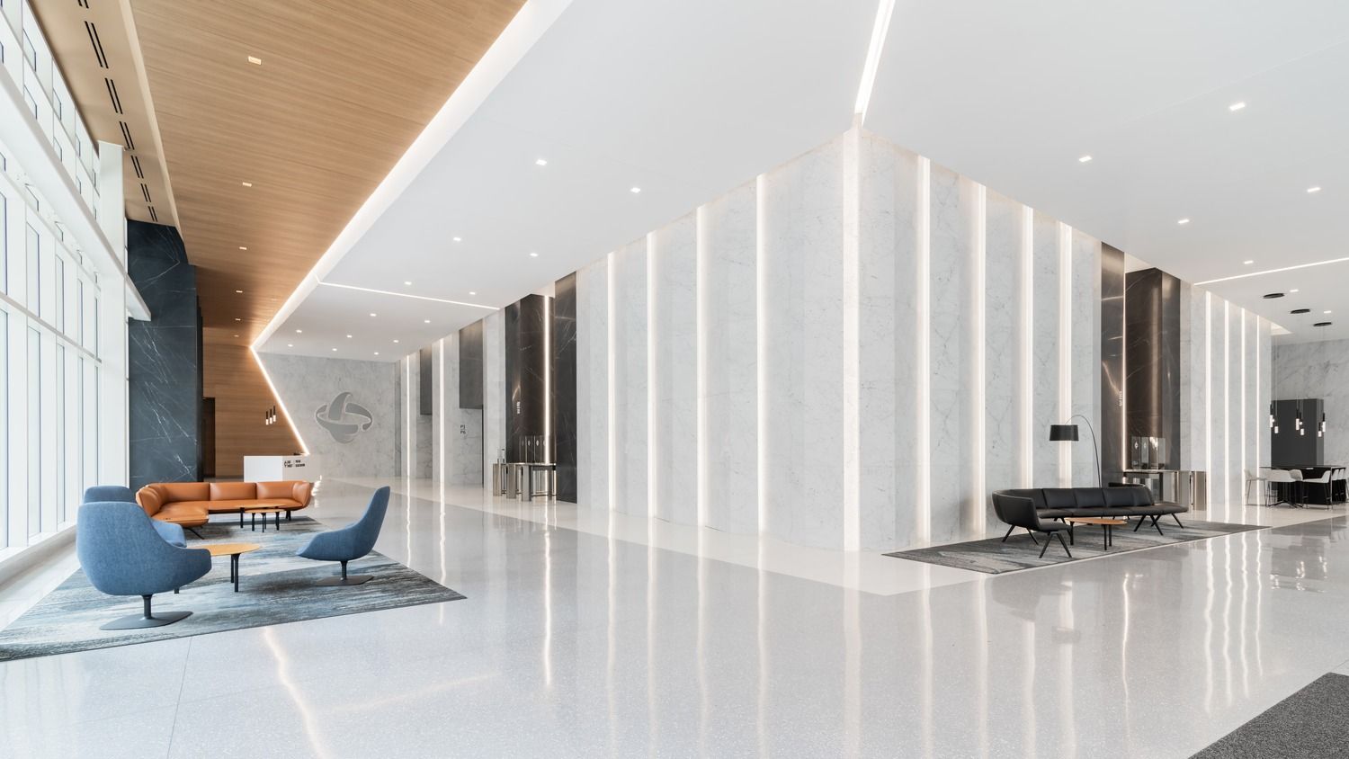Duke Energy: Blue armchairs in a bright lobby lit by long light strips