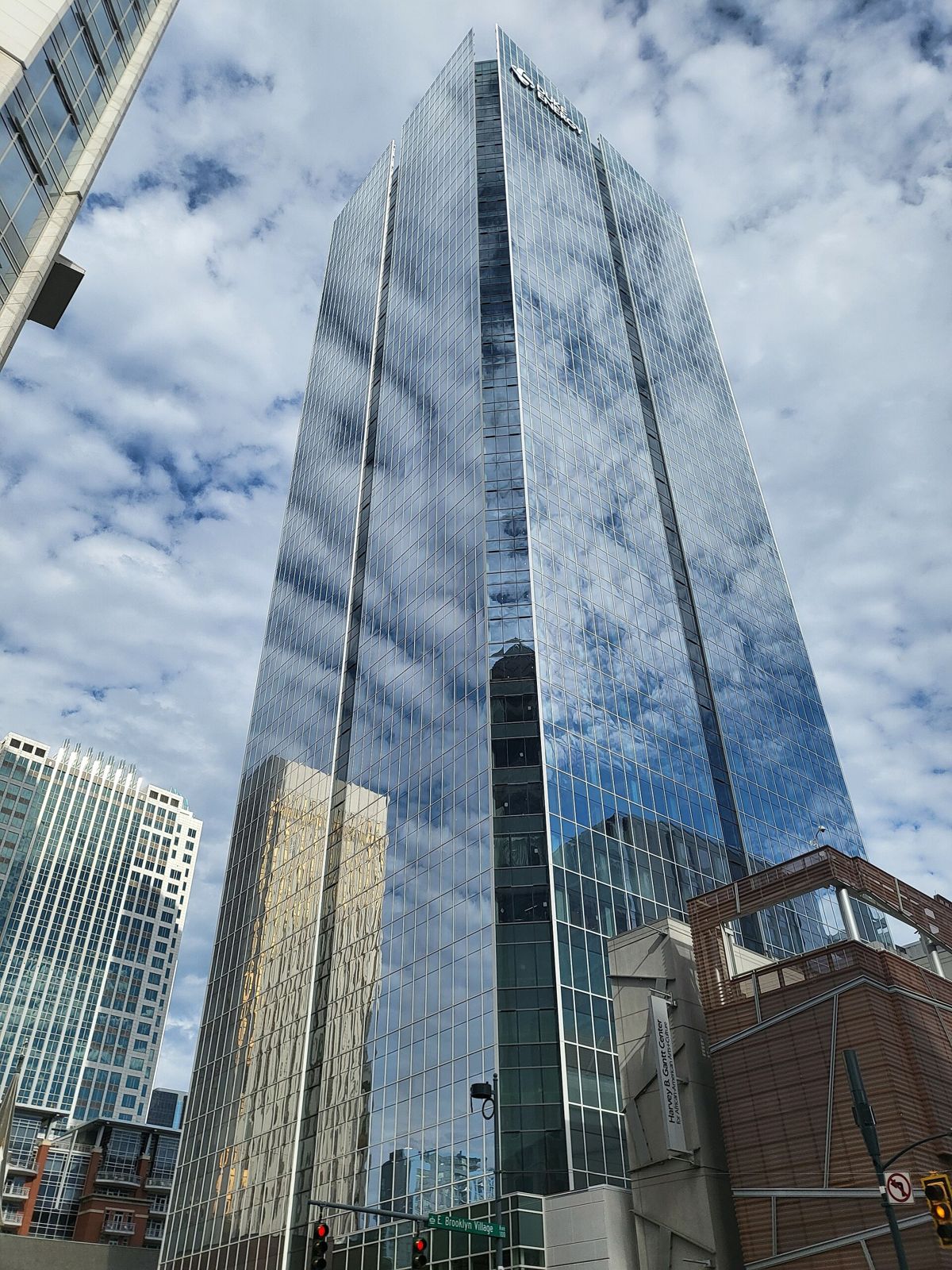 Duke Energy: Looking up at a glass tower reflecting clouds