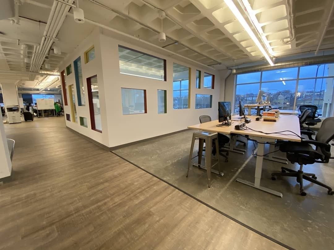 Duolingo: Bright work area with desks under a long skylight-style light