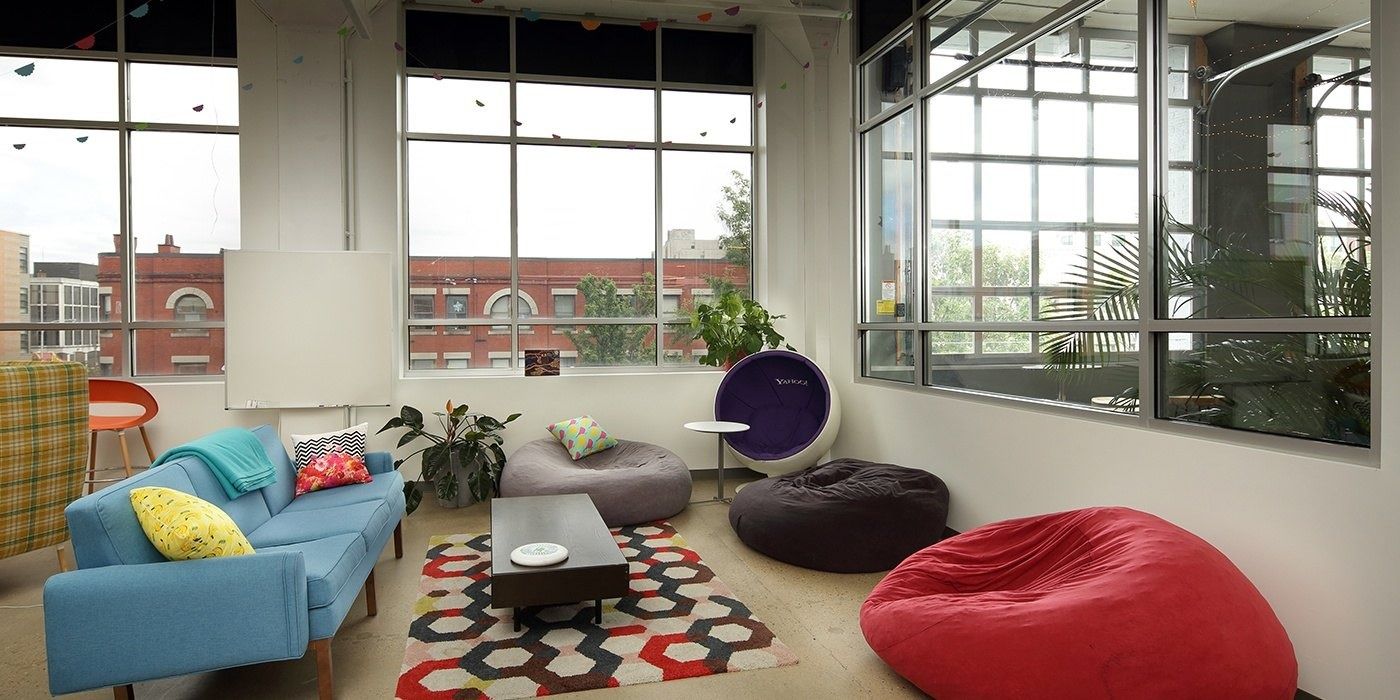 Duolingo: Lounge with sofas and large bean bags by corner windows