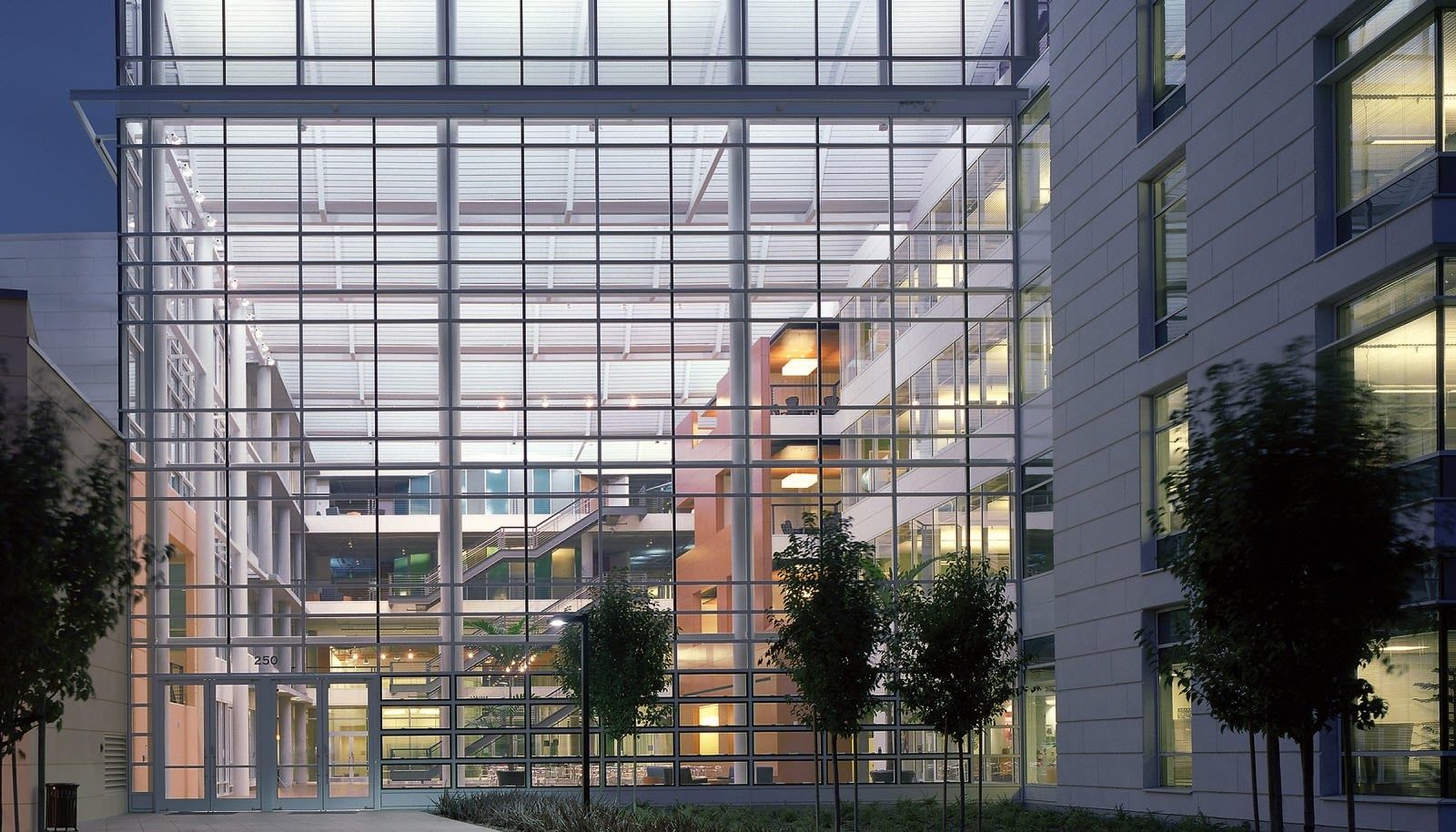 Electronic Arts: Glass curtain wall lobby seen from the courtyard at night