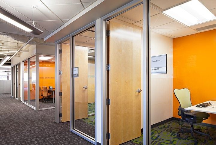 Eli Lilly and Company: Glass-front offices beside an orange wall