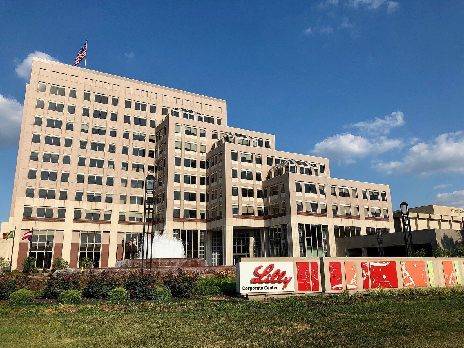 Lilly Corporate Center in Indianapolis behind a red Lilly sign