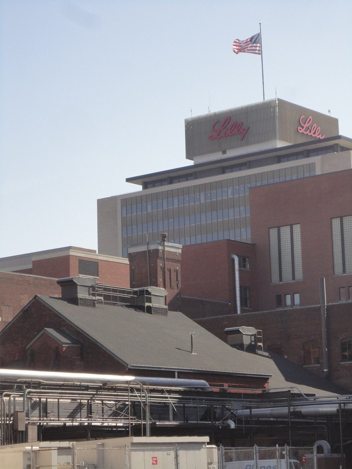 Eli Lilly and Company: Older brick buildings beneath the tower