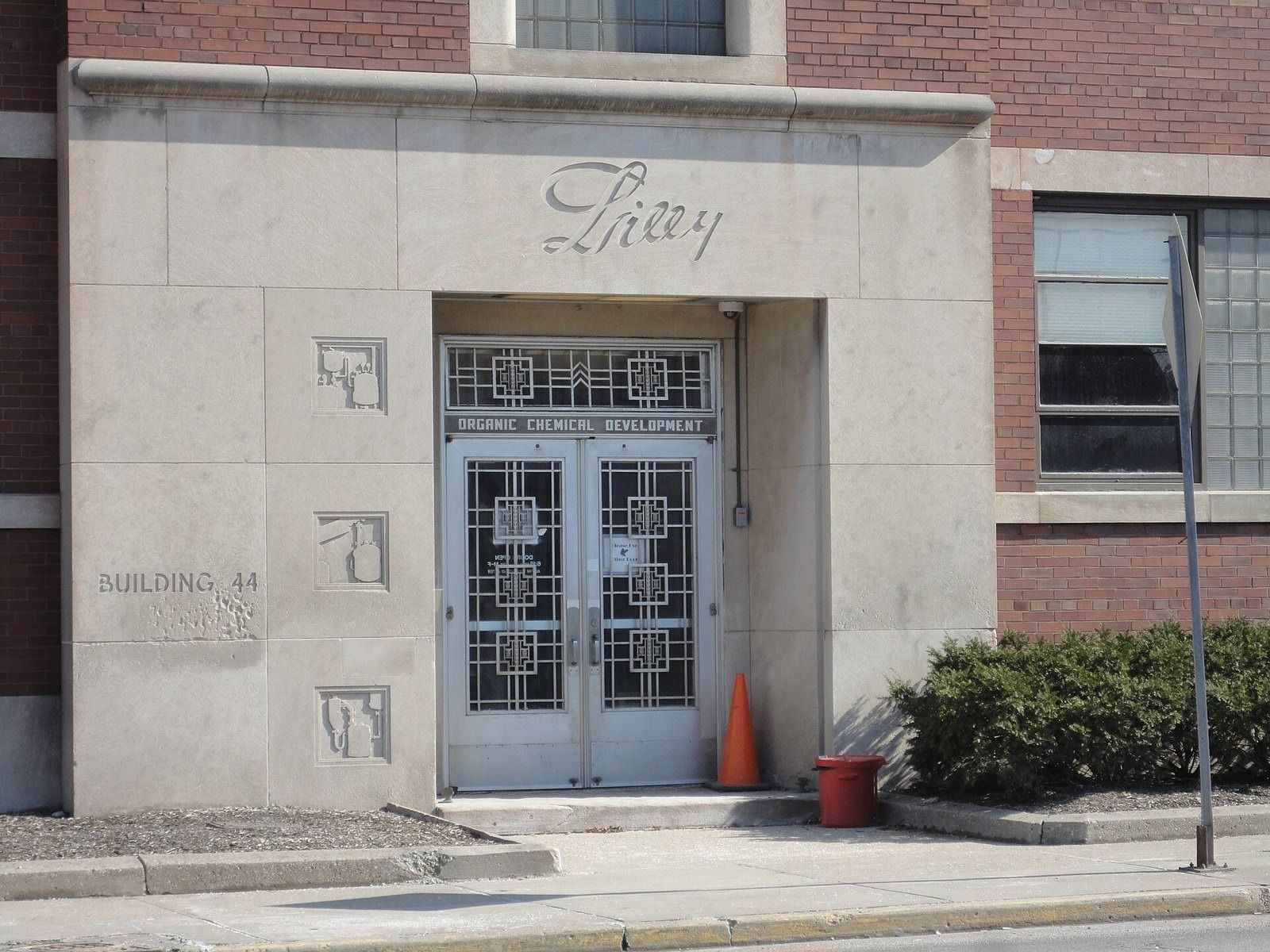 Eli Lilly and Company: The stone entrance of Building 44 with Art Deco doors