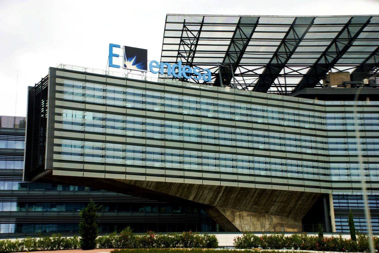 Endesa: The Endesa name above a cantilevered glass block with a sunshade roof