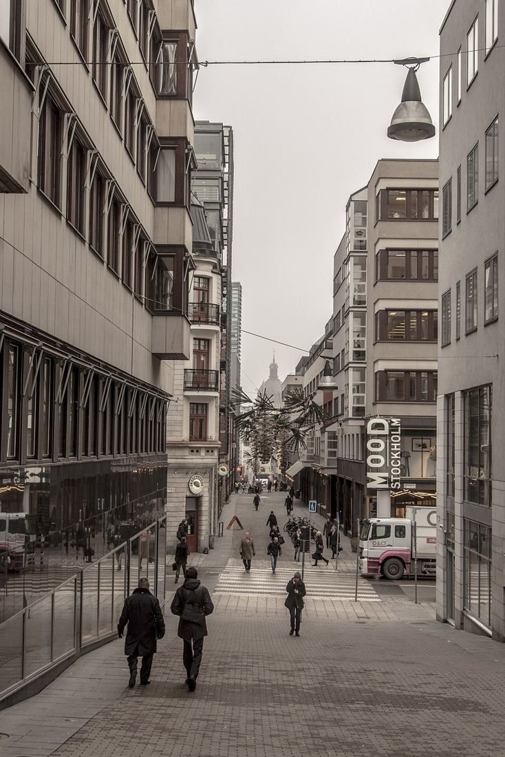 Narrow street Jakobsbergsgatan between stone buildings