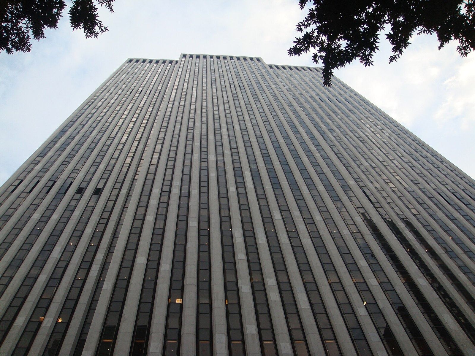 The Estée Lauder Companies: Wide upward view of a striped tower facade filling the frame