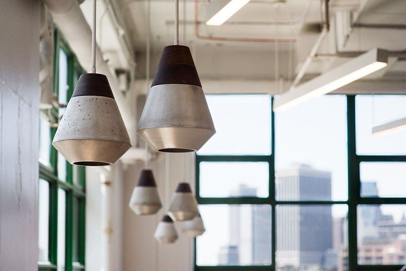 Etsy: Handmade pendant lamps in front of a factory window