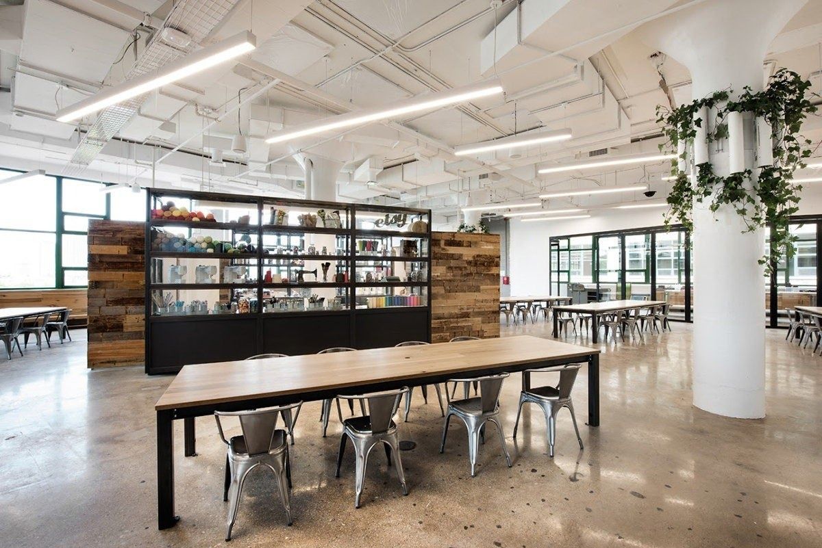Etsy: Large table area with a reclaimed-wood shelf wall