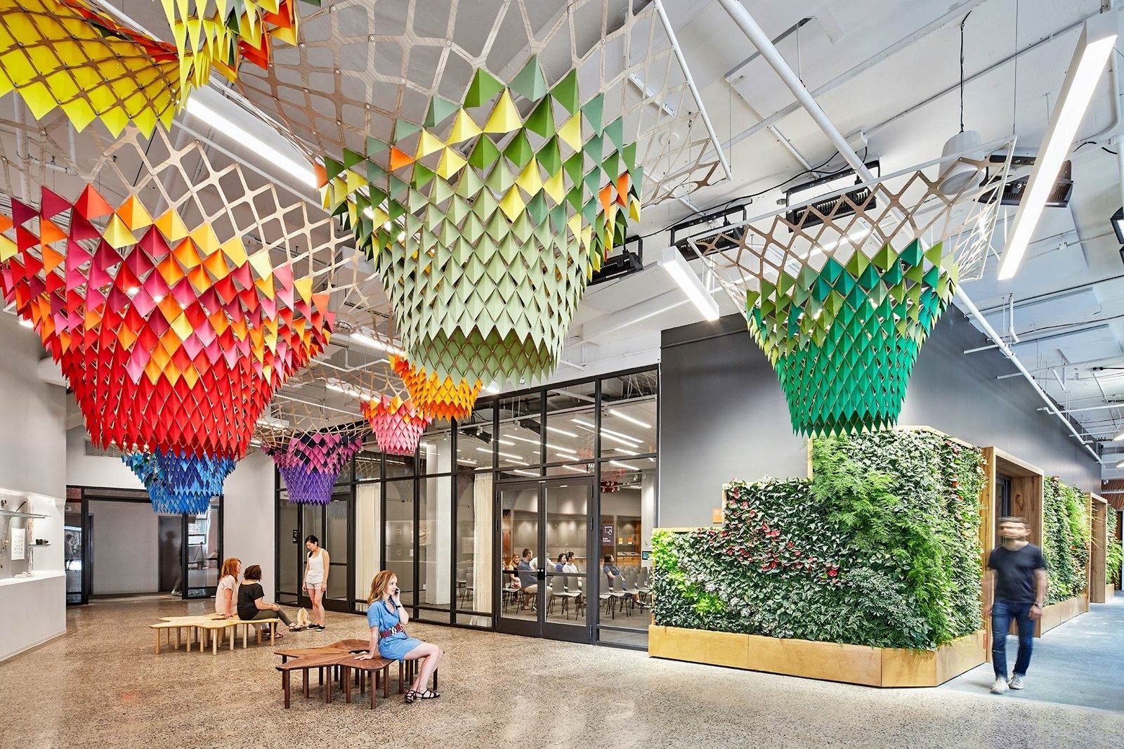 Etsy: Lobby with suspended woven sculptures and plant wall