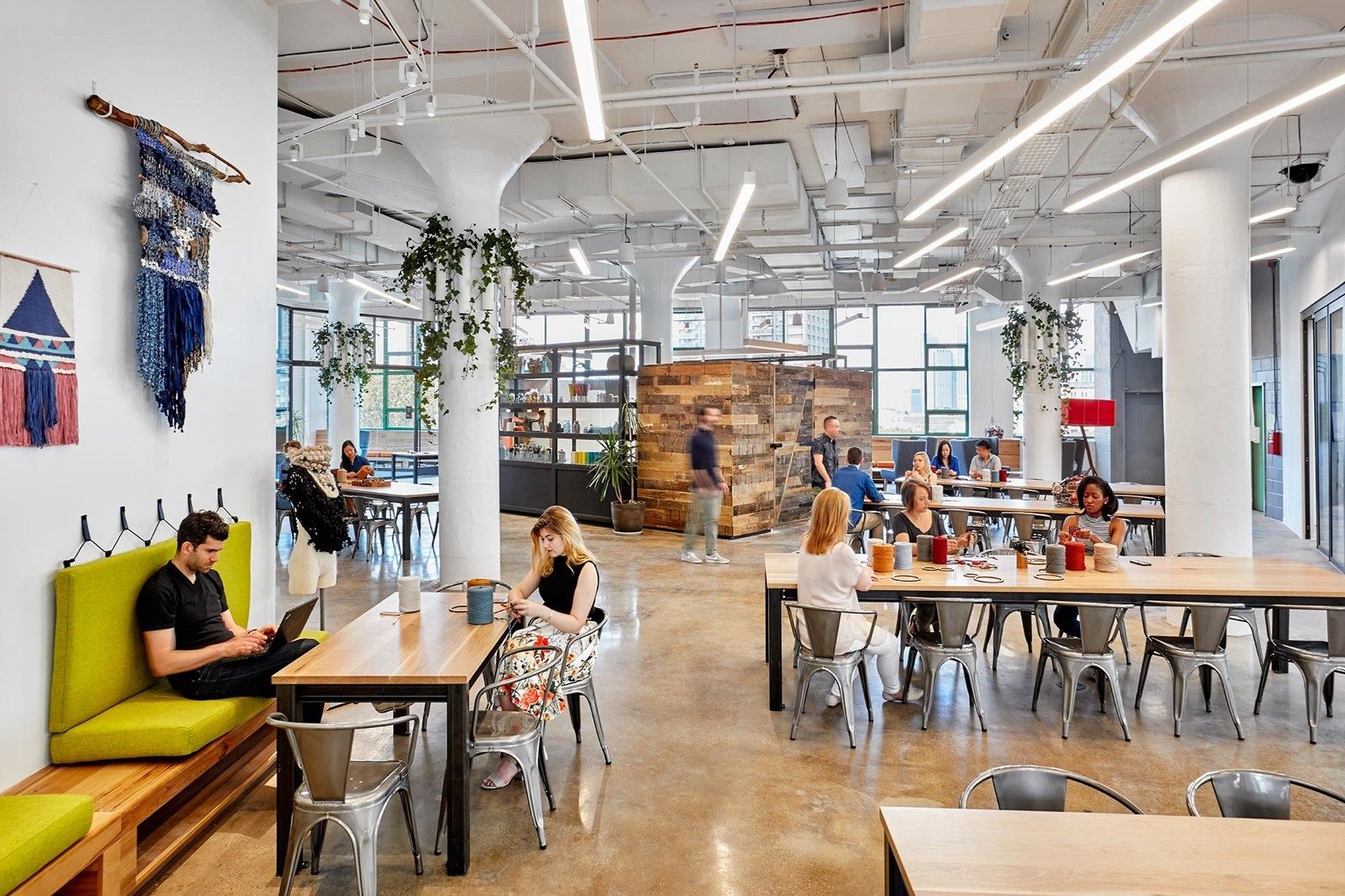 Etsy: Open work floor with communal tables, banquettes and plants