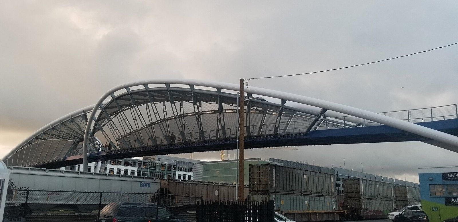 Expedia Group: Arched pedestrian bridge over the rail lines