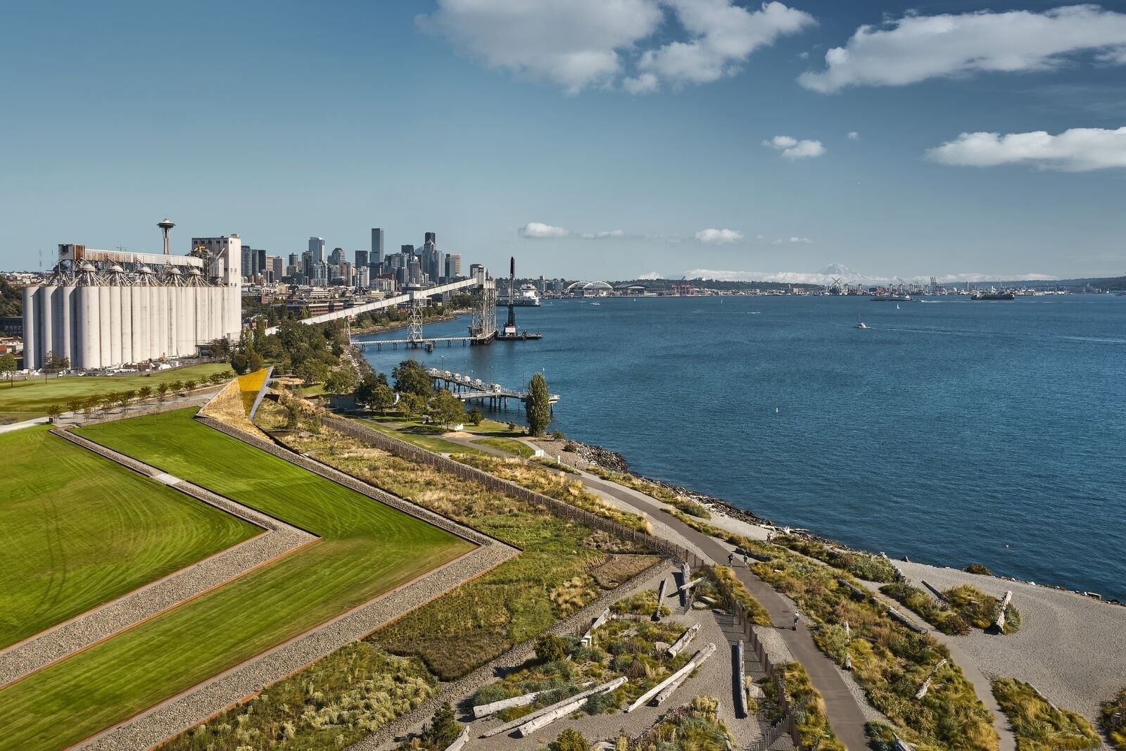 Expedia Group: Landscaped lawns stepping down to the waterfront with downtown Seattle behind