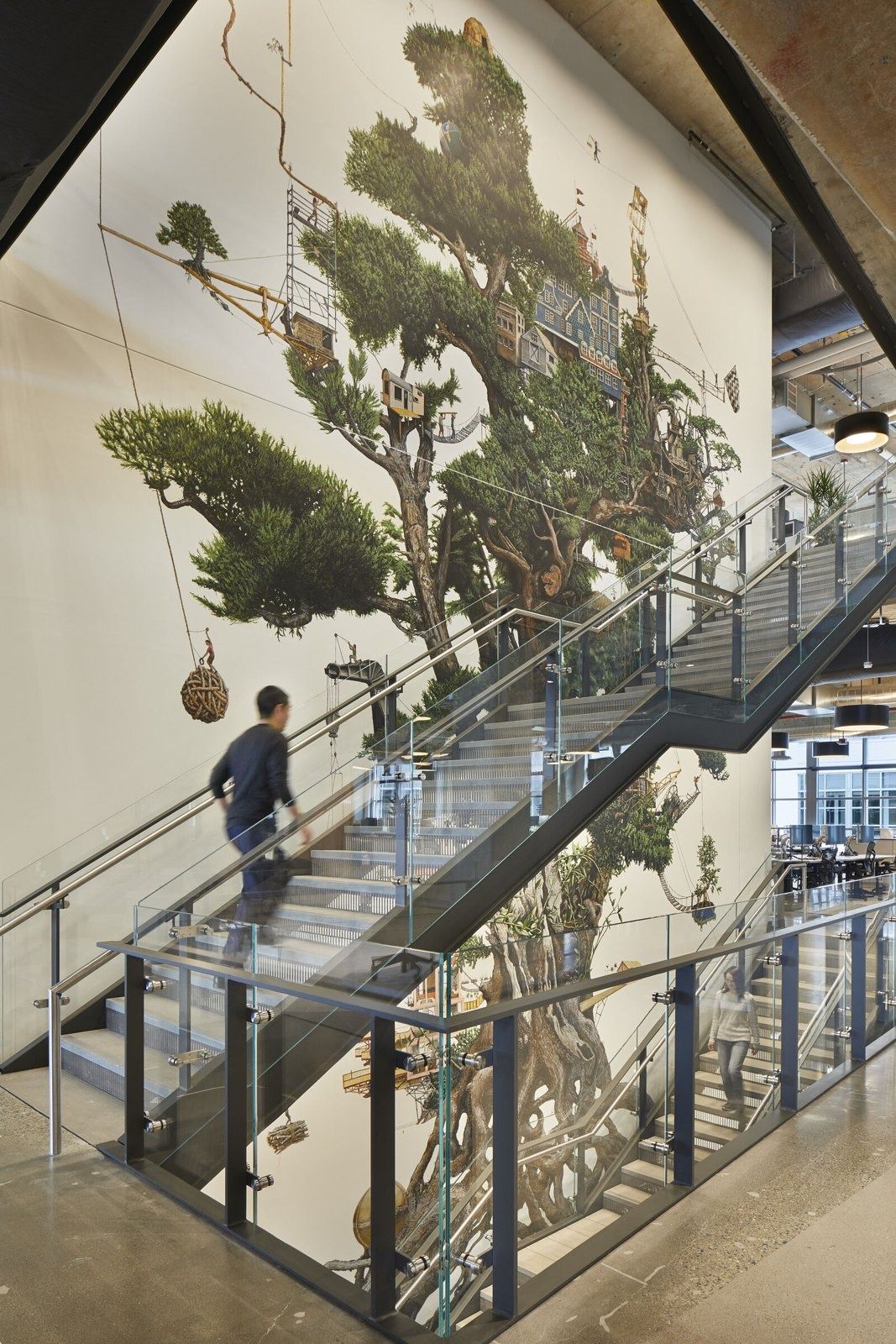 Expedia Group: Stair beside a large painted tree mural
