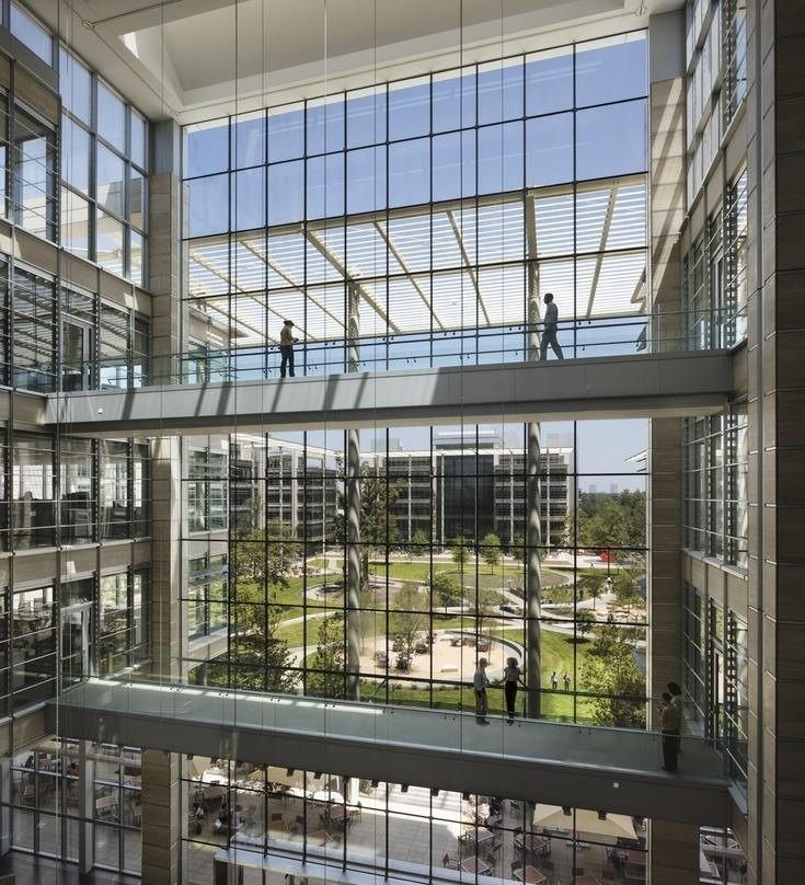 ExxonMobil: Glass bridges inside a tall glass atrium