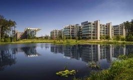 ExxonMobil: Office buildings reflected in a lake