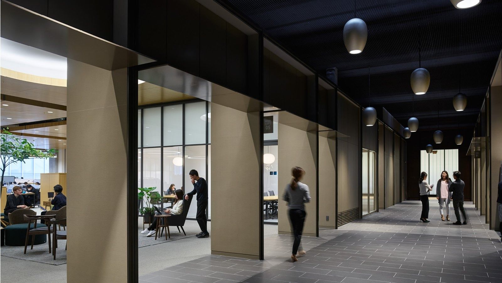 Fast Retailing (UNIQLO): Wide interior street lined with timber-framed meeting rooms