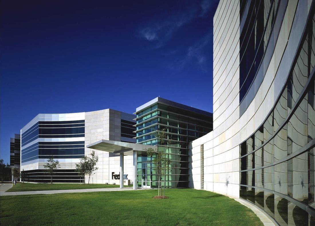 FedEx: Glass and metal-panel buildings around a lawn, with a curved facade on the right