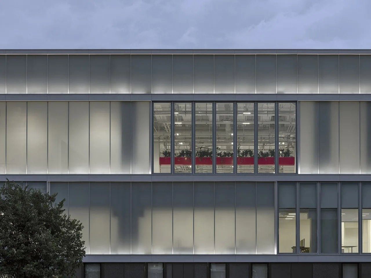 Ferrari: Glass façade with a red-lit floor inside