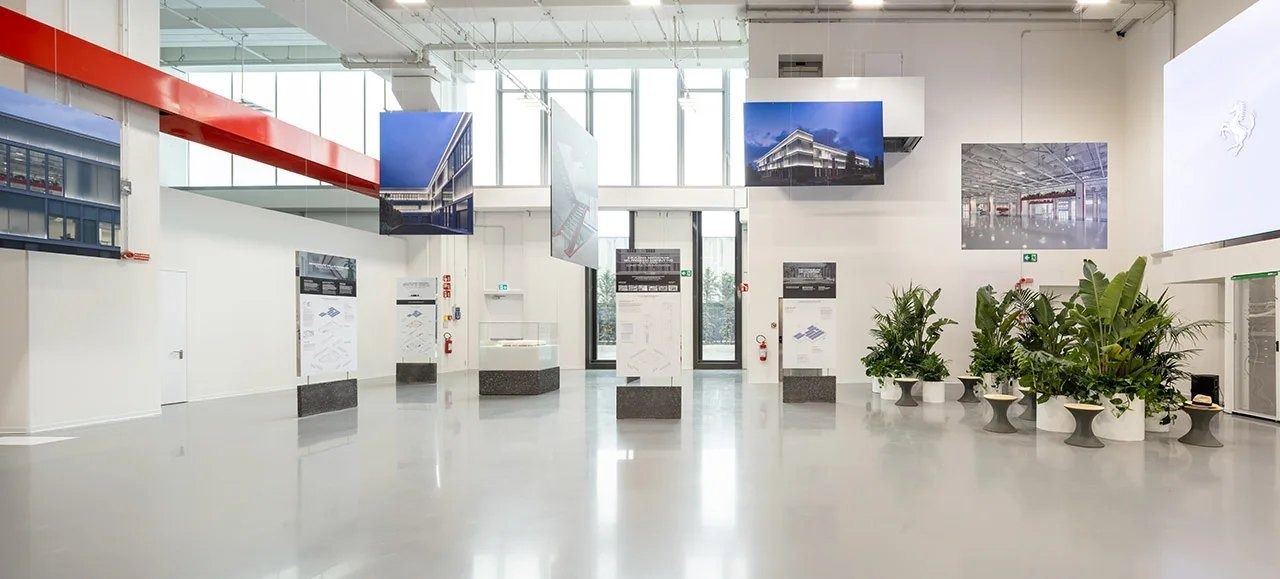 Ferrari: White exhibition hall with plants
