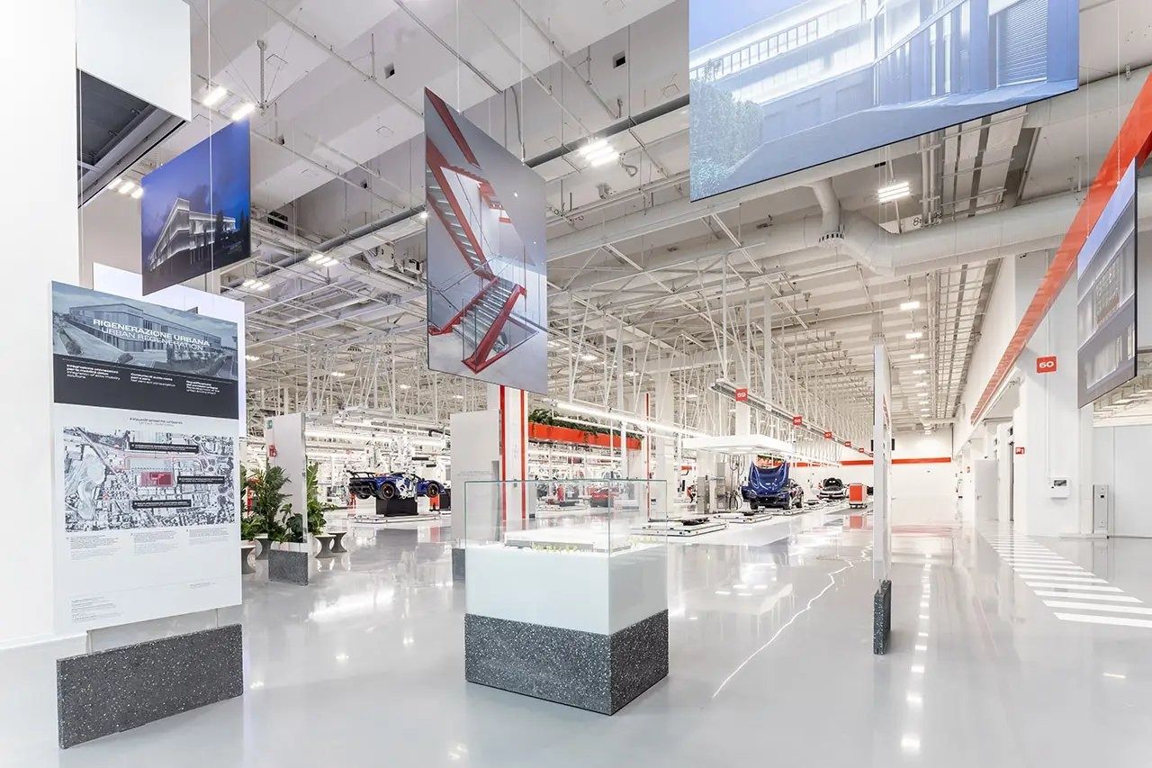 Ferrari: Wide white hall with exhibition panels