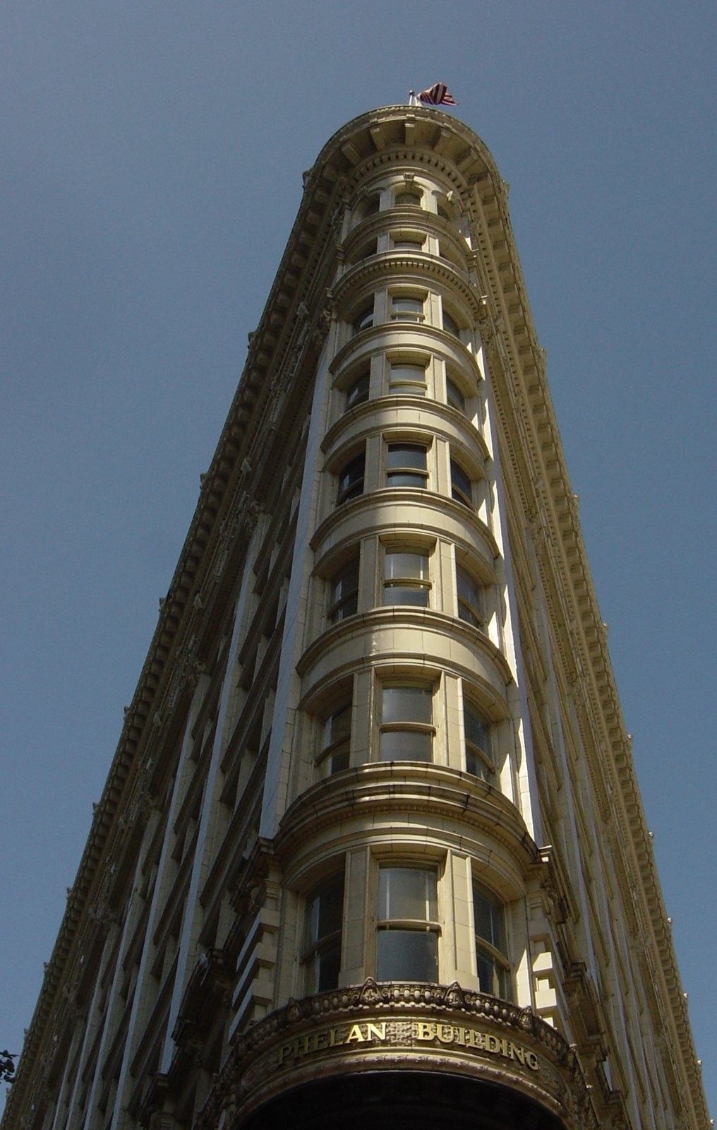 Figma: Close view of the rounded, ornate corner bays of the building