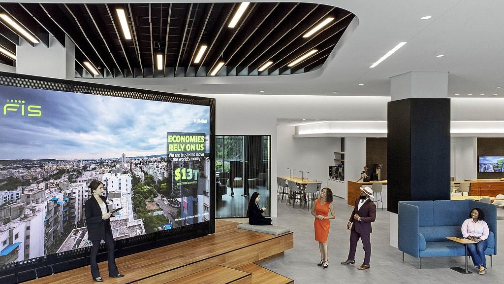 FIS: A town hall stair with a giant screen and lounge seating